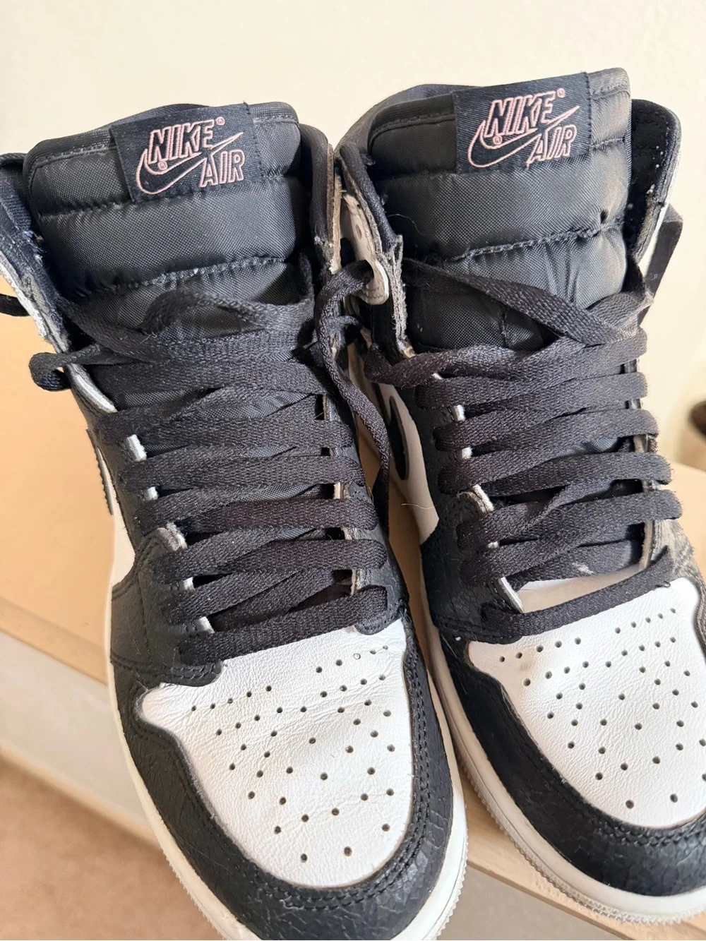 Nike Air Jordan 1 Black and White High-Top Sneakers with Pink Accent